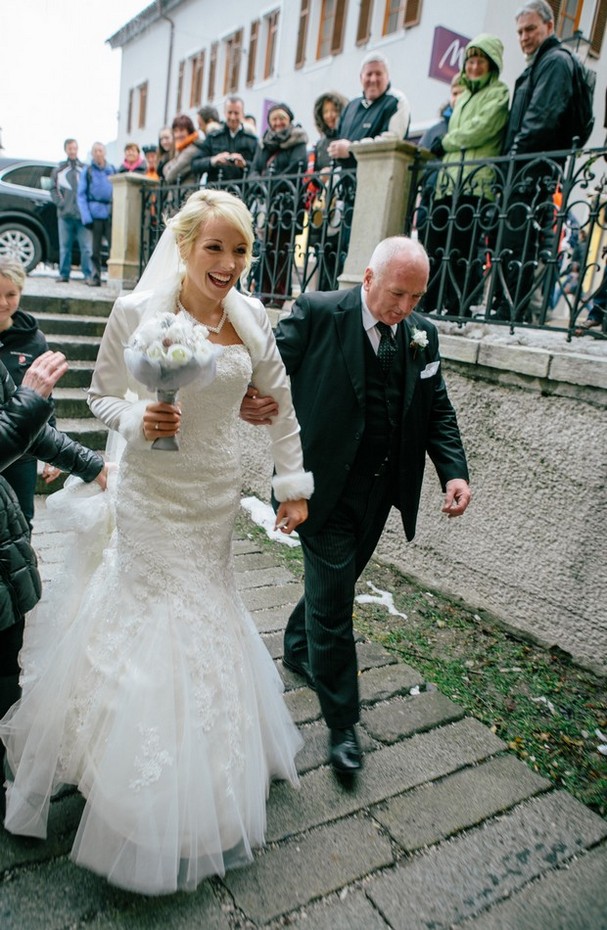 bride and father walking up aisle winter wedding