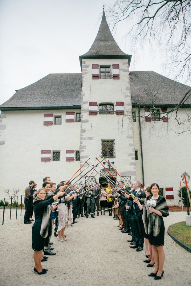 winter wedding guard of honour with skis