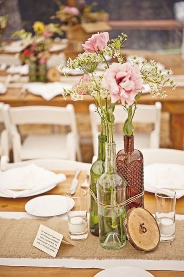 rustic wedding centerpiece ideas flower filled bottles twine