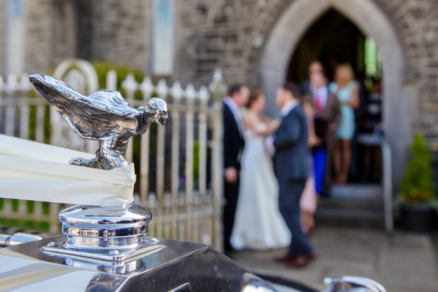 wedding guests gather outside church