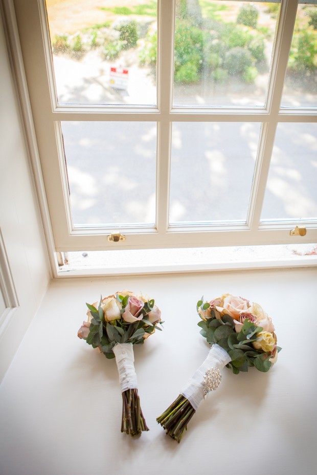 soft pink wedding bouquets in window