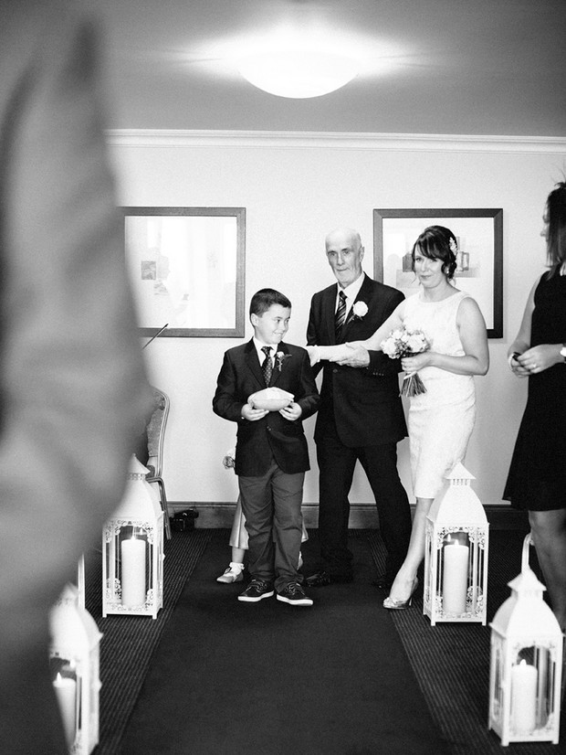 black and white bride walking up aisle