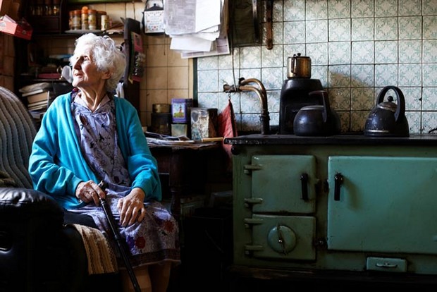 portrait of elderly woman in kitchen