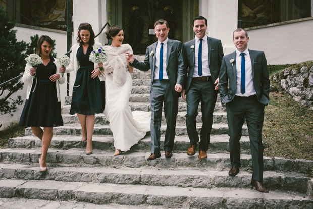 bridal-party-bridesmaids-in-green-dresses-groomsmen-in-grey-suits