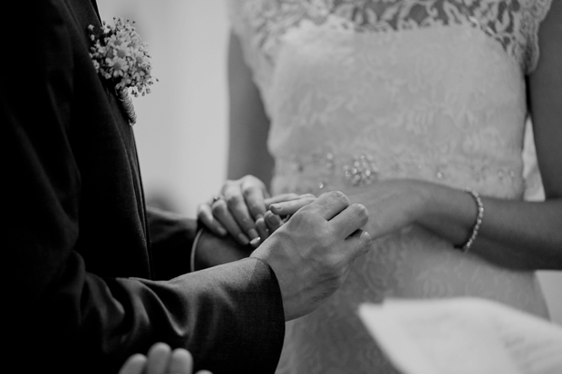 bride-and-groom-exchanging-rings-at-church-wedding-ceremony-germany