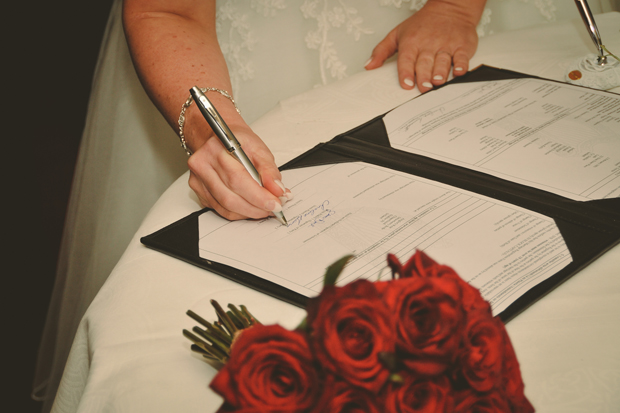 charlene-stephen-wedding-bride-signing-register