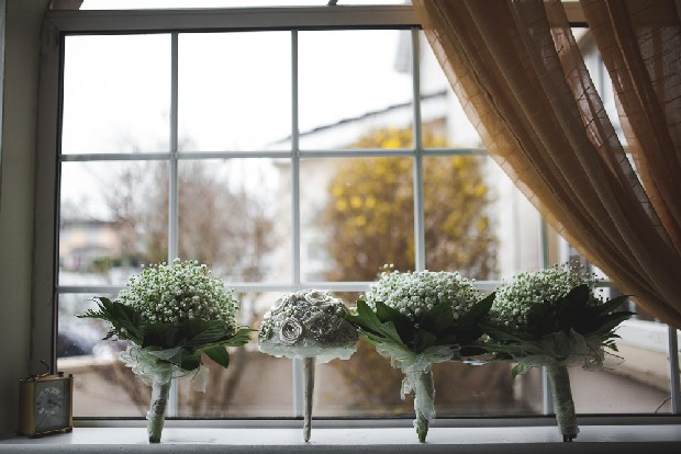 7-photo-of-bridesmaids-bouquet-babys-breath-on-window