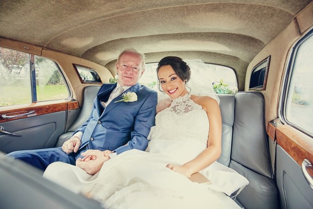 bride-father-in-car-holding-hands