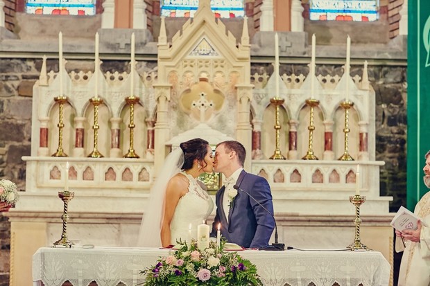 bride-groom-kiss-altar-wedding-ceremony