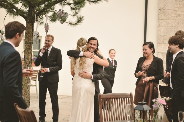 bride-hugging-groomsman