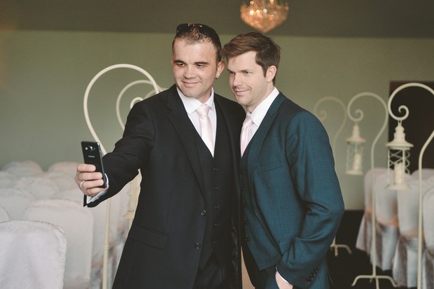 groom-groomsman-taking-selfie-waiting-bride