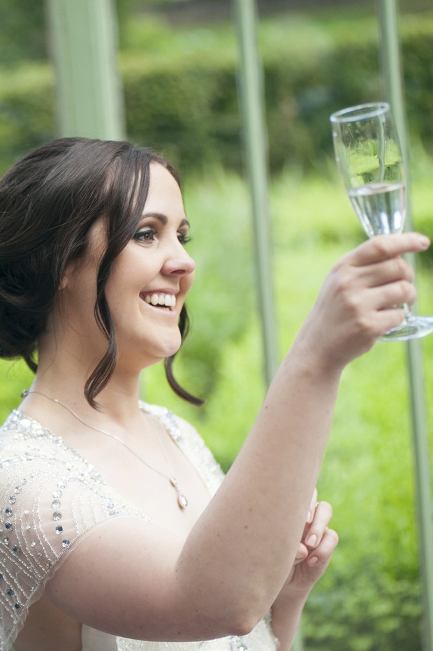 bride-toasting-glass-champagne