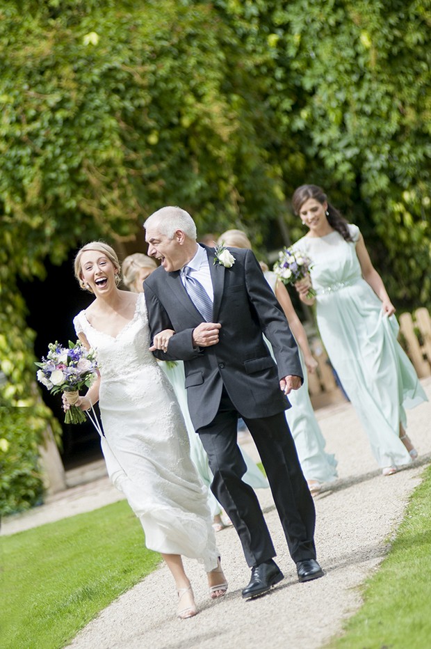 happy-bride-father-laughing-up-aisle
