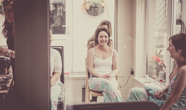 15_bride_getting_hair_done_wedding_morning