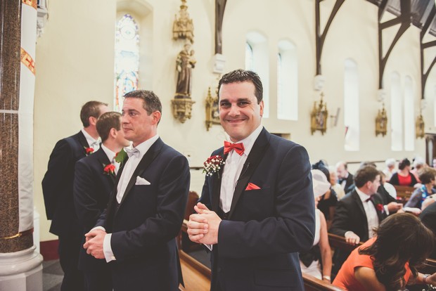 Groomsmen-waiting-altar-church-ceremony-Emma-Russell-Photography-weddingsonline