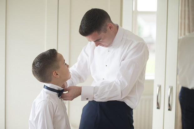 groom-fixing-page-boy's-bow-tie