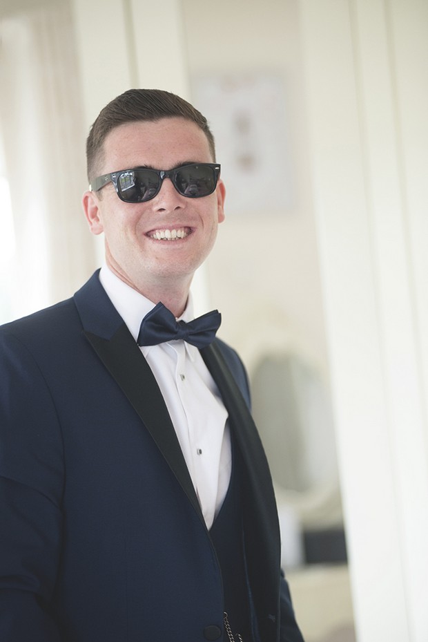 groom-in-black-tie-with-sunglasses