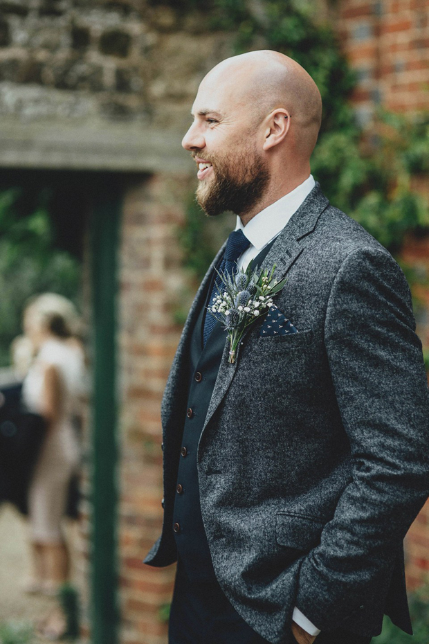 groom-in-grey-wool-jacket-with-navy-waitscoat-and-navy-wool-tie