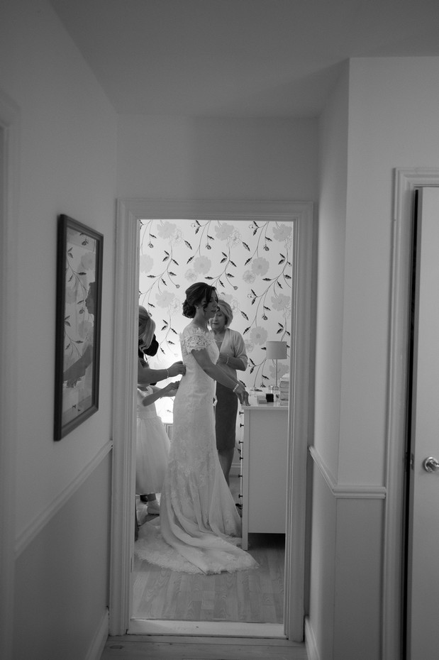hamlet-court-hotel-real-wedding-bride-getting-in-to-dress