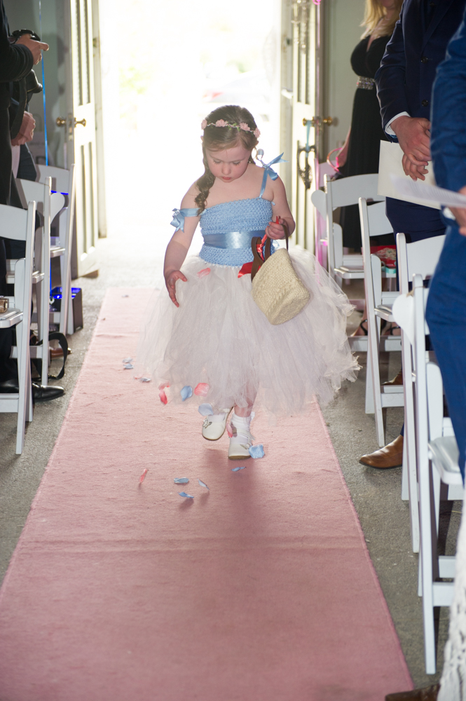 12-flower-girl-aisle-petals-real-wedding-The-Fennells-weddingsonline